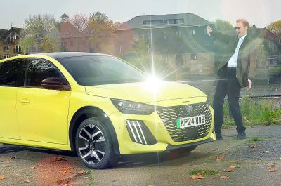 James Tute being dazzled by Peugeot E-208