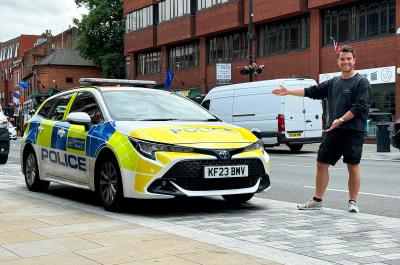 Jonty next to a police Toyota Corolla Touring Sports