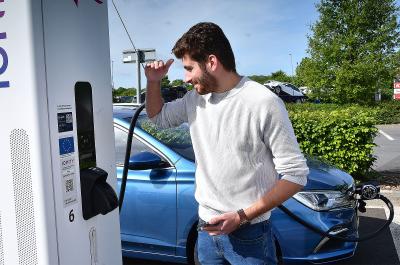 Kiall Garrett using an electric car charger