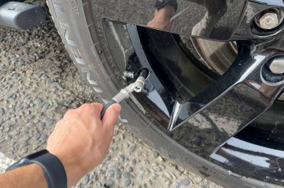 Land Rover Defender having a tyre pumped up