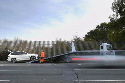 LT BMW iX3 with breakdown recovery truck
