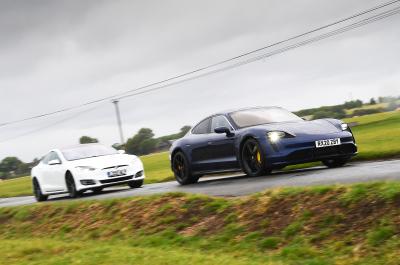 Porsche Taycan and Tesla Model S front action