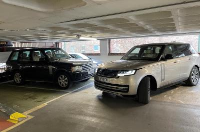 Range Rover with older sibling in car park