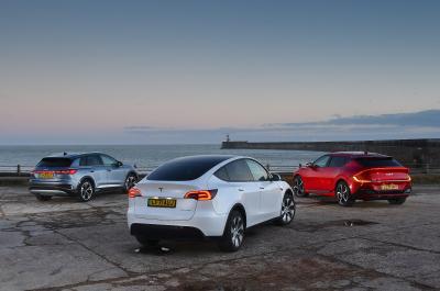 New Tesla Model Y vs Audi Q4 e-tron vs Kia EV6 rear triple