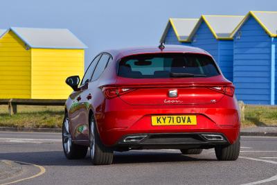 Red Seat Leon rear cornering with beach huts