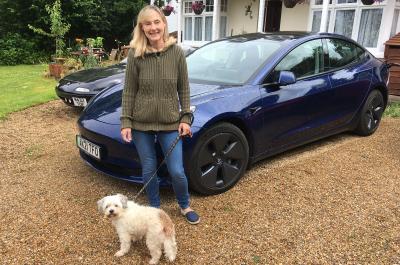 Tesla Model 3 electric car with Claire and dog