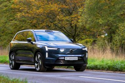 A Thatcham Volvo driving on the road through trees