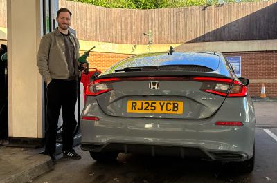 Tom filling up the Honda Civic at a petrol station