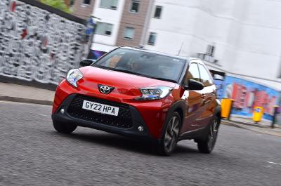 Red Toyota Aygo X front cornering