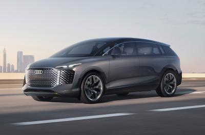 Audi Urbansphere concept on the road with city skyline in background