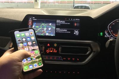 Used BMW 3 Series interior with mobile phone