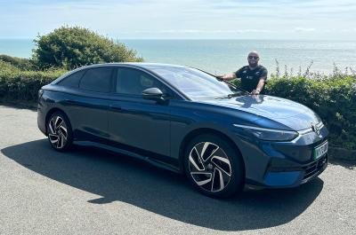 Volkswagen ID 7 front three quarter parked at the coast