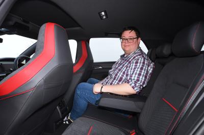 Volkswagen Golf GTI LT with person sitting in the back