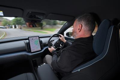 Volvo EX30 over shoulder driving