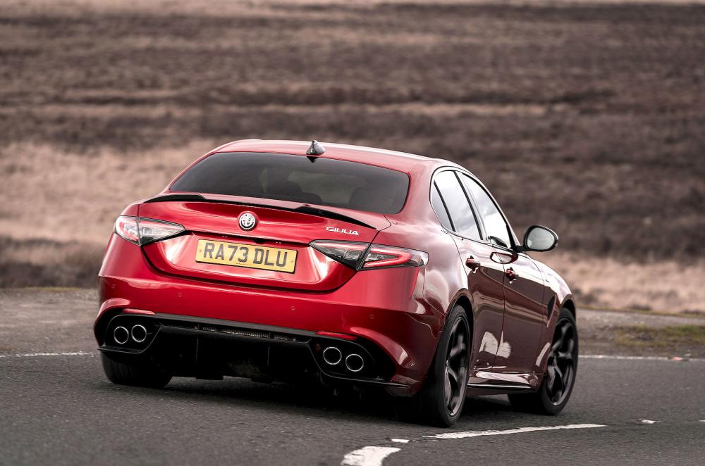 Red Alfa Romeo Giulia Quadrifoglio rear cornering