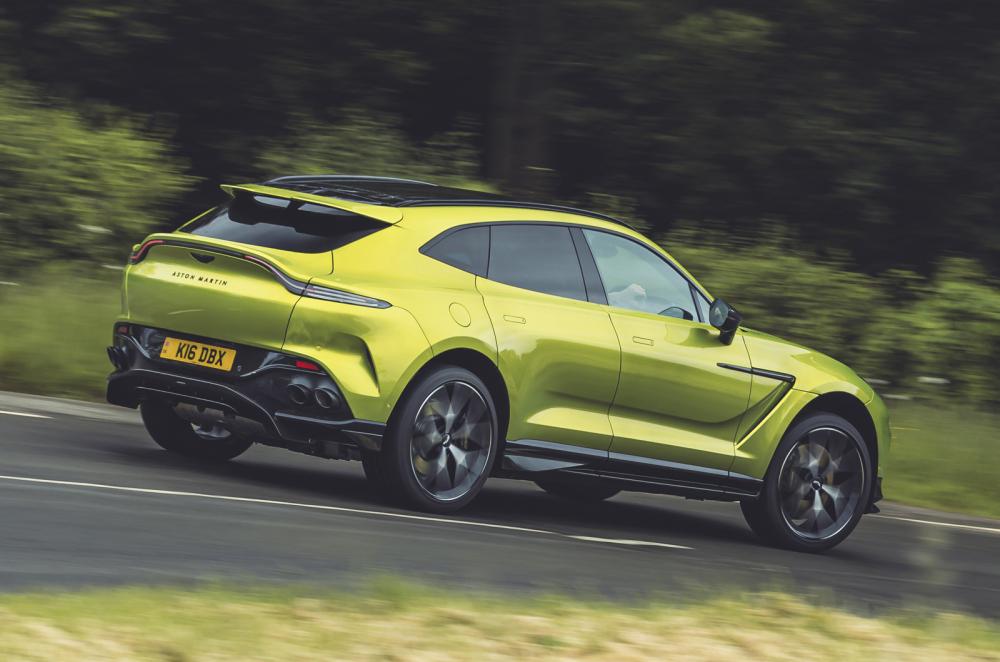 Aston Martin DBX rear driving bright green