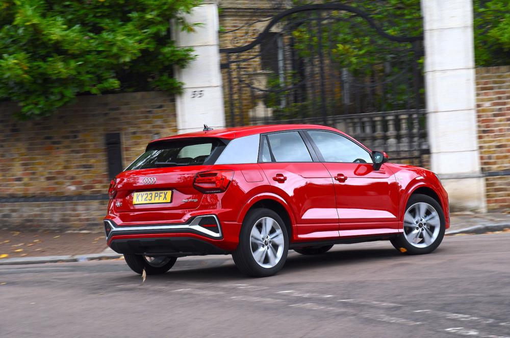 Red Audi Q2 rear right driving