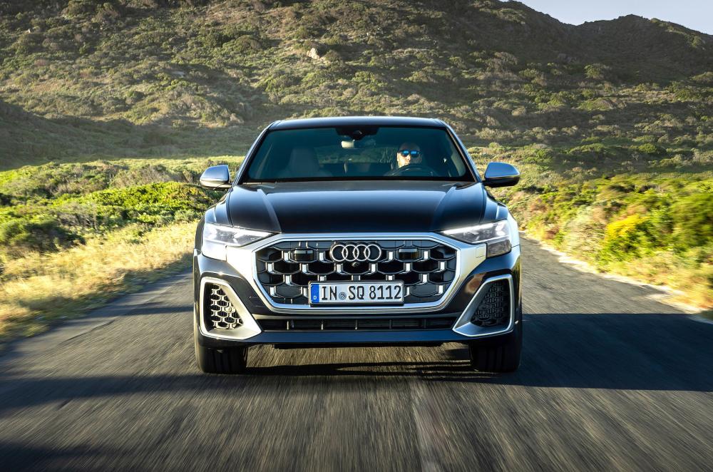 Blue Audi SQ8 front driving