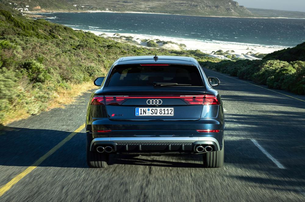 Blue Audi SQ8 rear driving