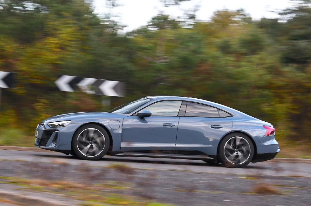 Audi E-tron GT side driving around roundabout