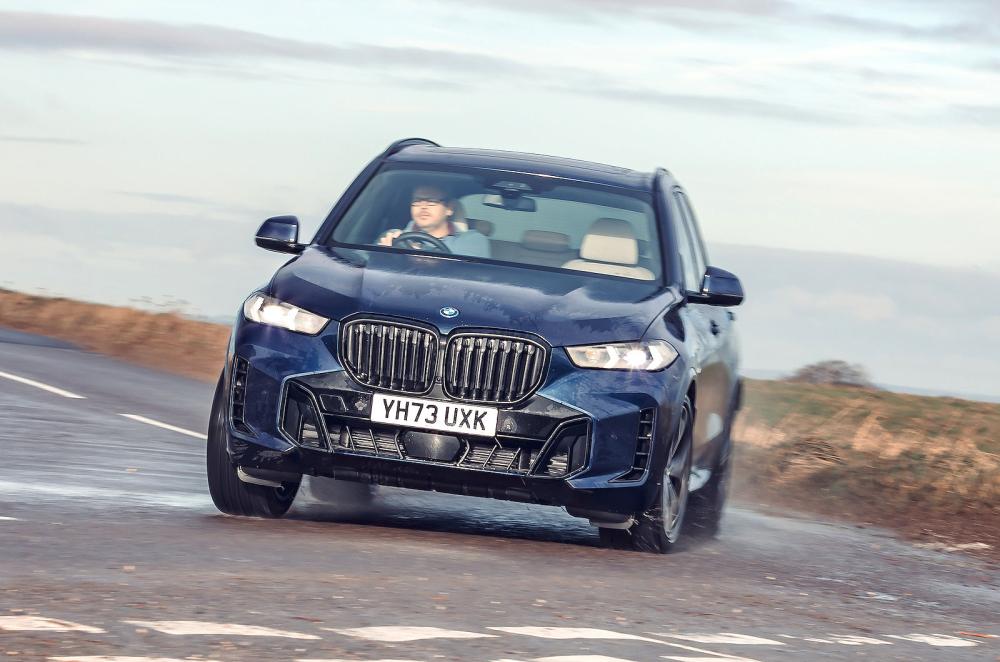 Blue BMW X5 front cornering