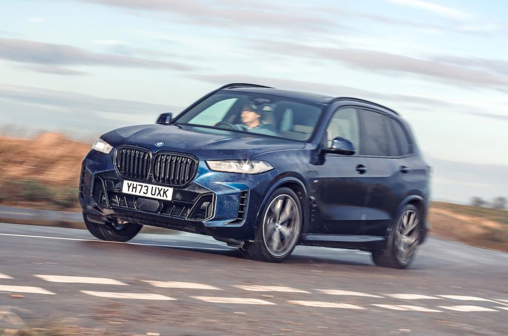 Blue BMW X5 front left driving