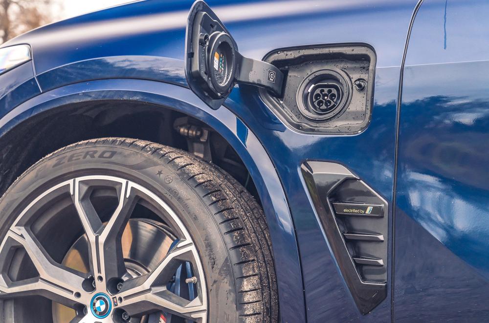 Blue BMW X5 PHEV charging socket detail