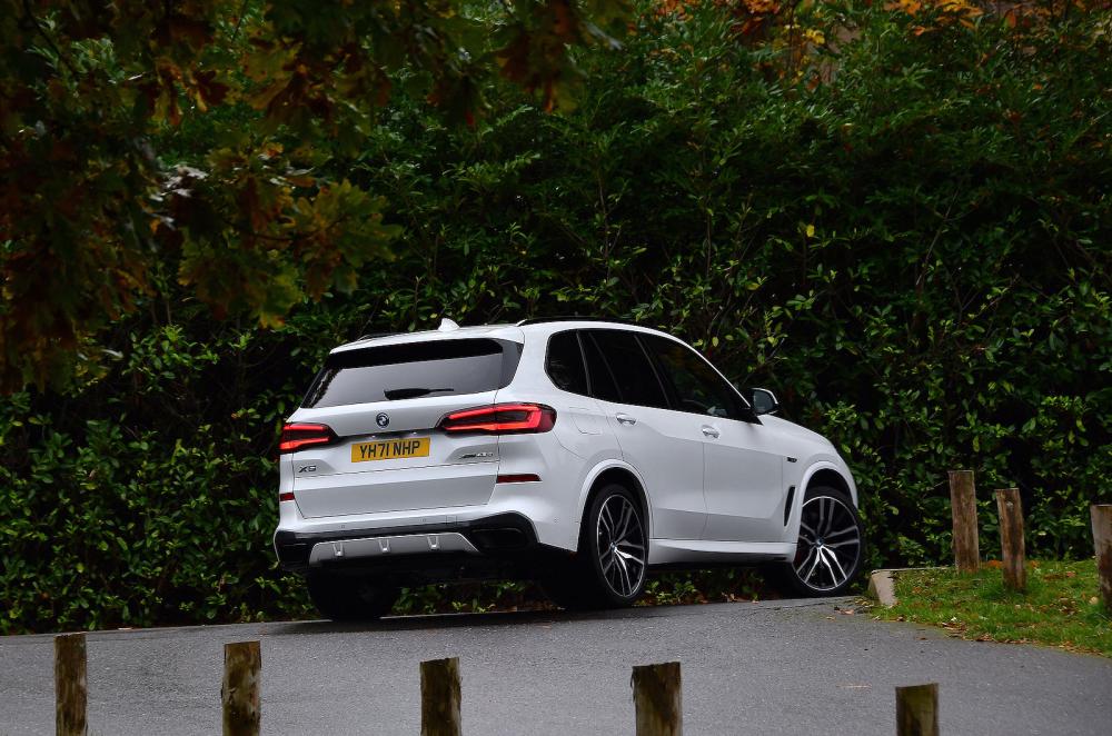 Blue BMW X5 rear cornering