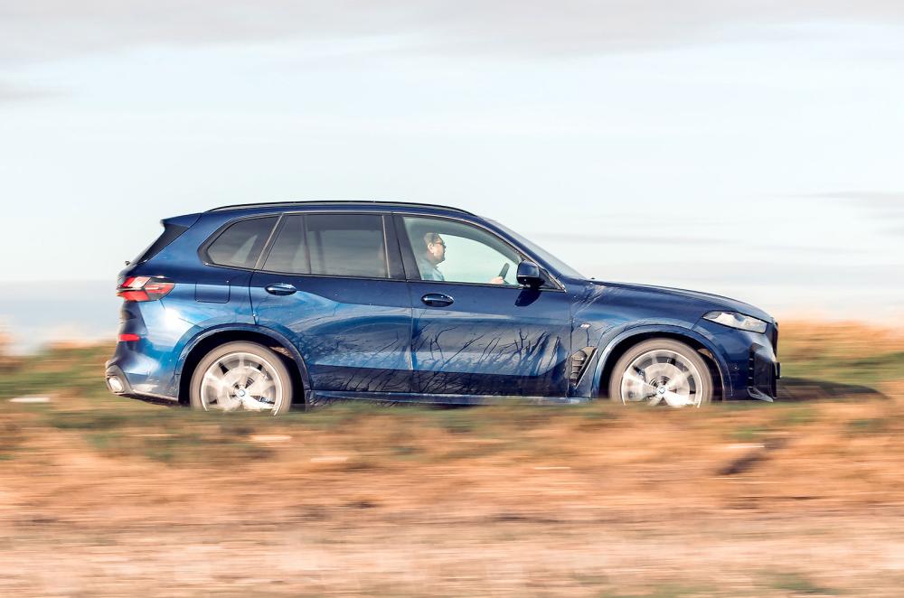 Blue BMW X5 right driving