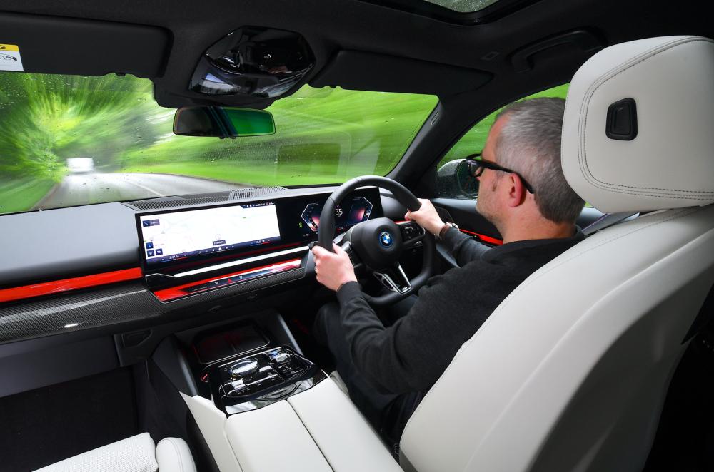 BMW i5 Touring over-the-shoulder driving