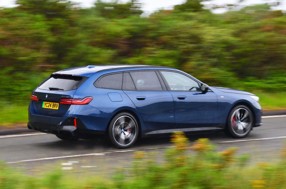 BMW i5 Touring rear driving