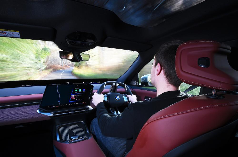 BMW iX3 driving from behind the wheel