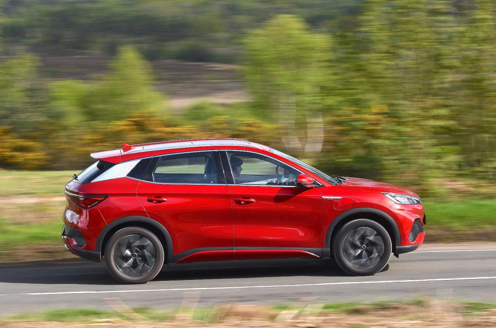 Red BYD Atto 3 right driving