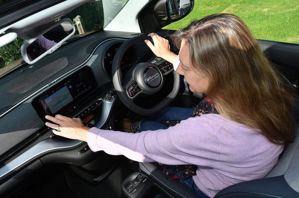 Claire Evans using Electric Fiat 500 touchscreen