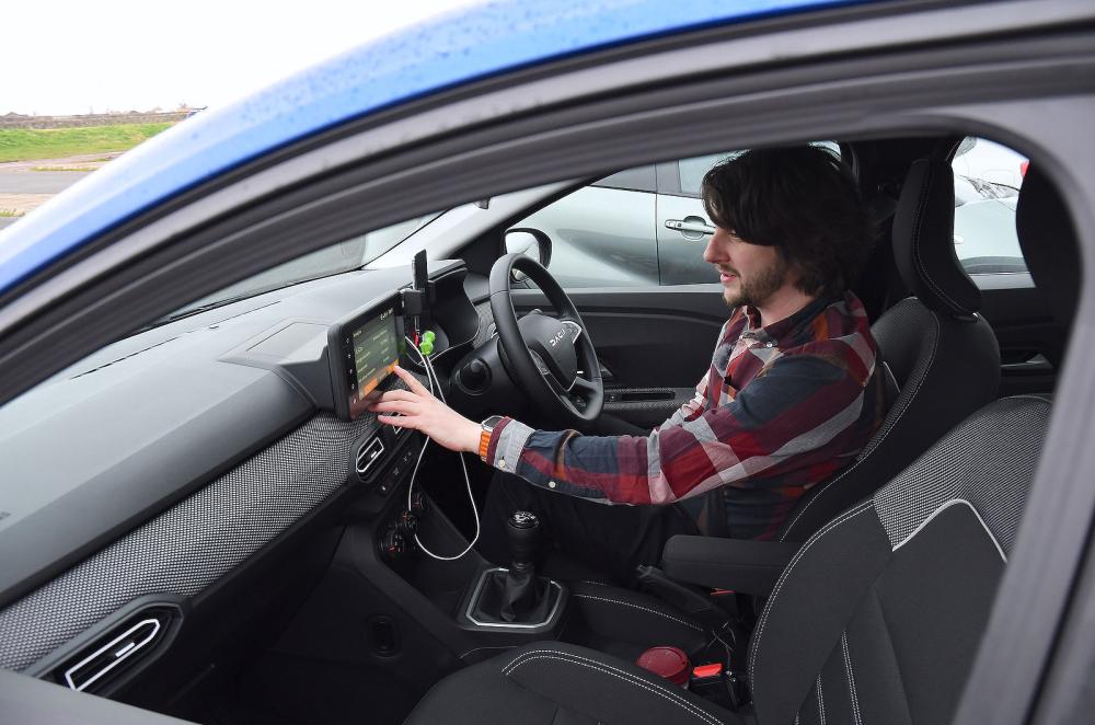 Dan Jones in Dacia Sandero front seats