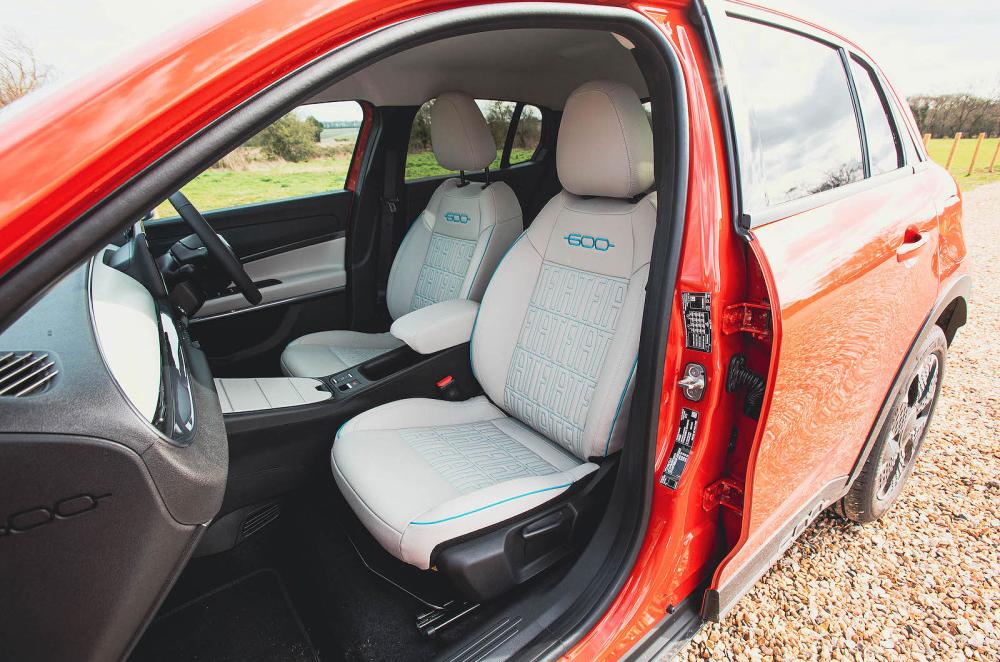 Orange Fiat 600e front seats