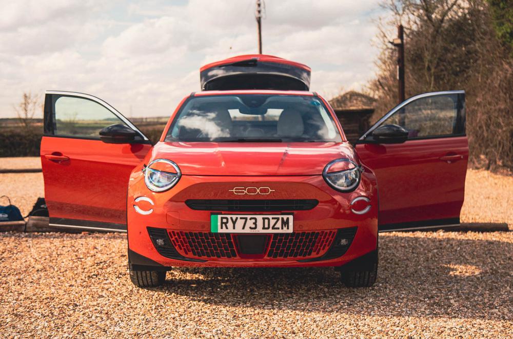 Orange Fiat 600e front static doors open