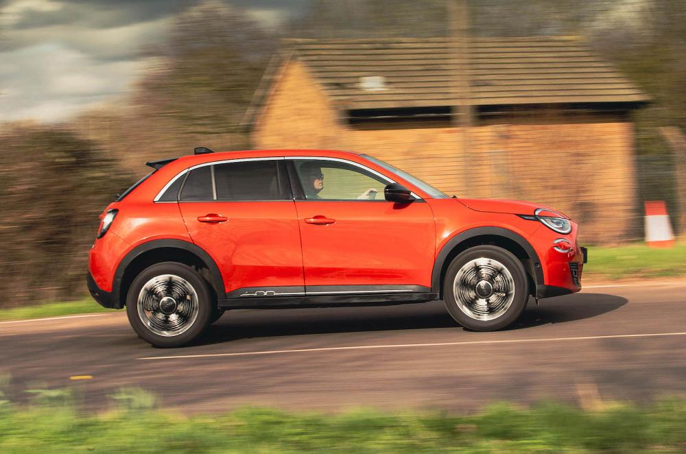 Orange Fiat 600e right driving