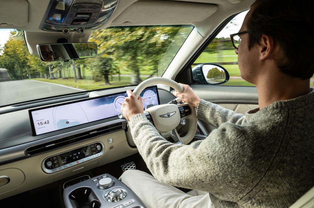 Genesis GV60 over-shoulder driving