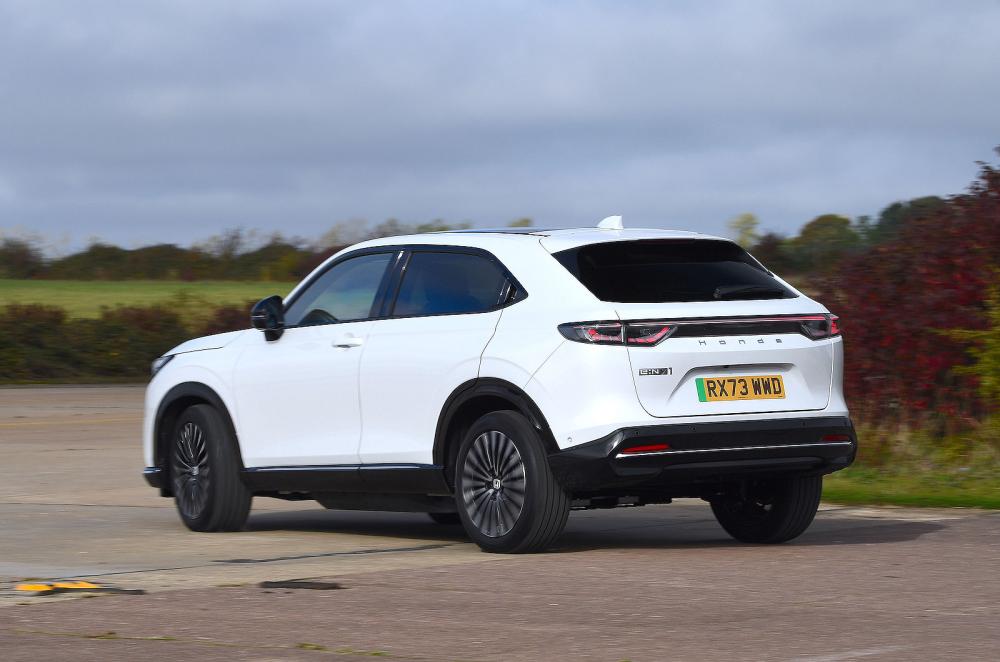 White Honda e:Ny1 rear cornering