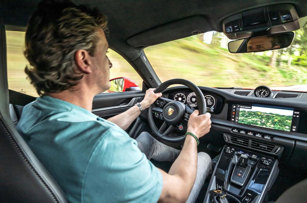 John Howell test driving Porsche 911