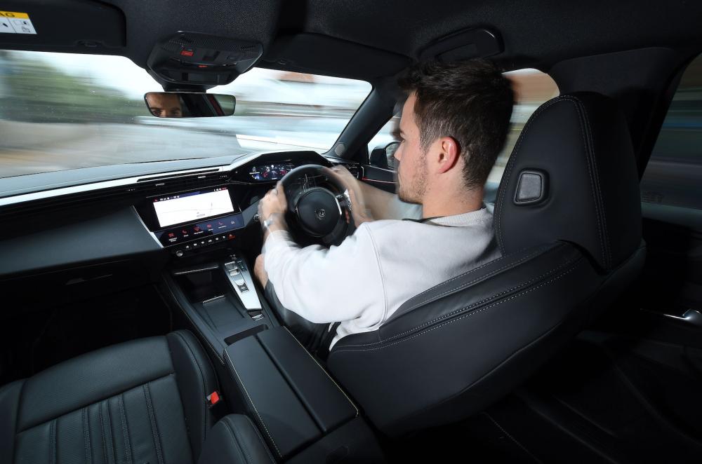 Jonty Renk test driving Peugeot 408