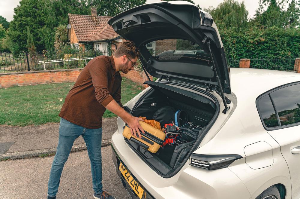 Kiall Garrett loading Peugeot 308 boot