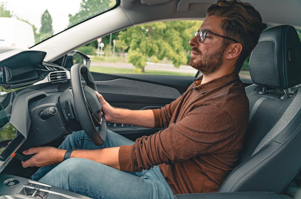 Kiall Garrett testing Peugeot 308 front seats