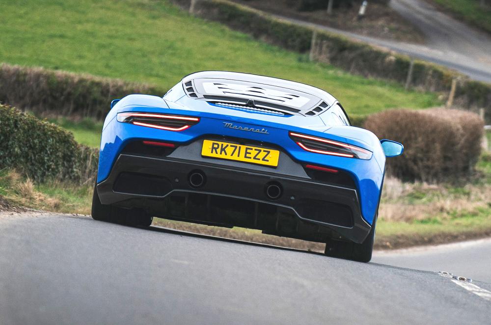 Blue Maserati MC20 rear cornering