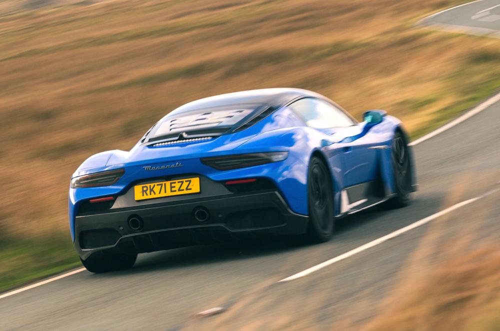 Blue Maserati MC20 rear right driving