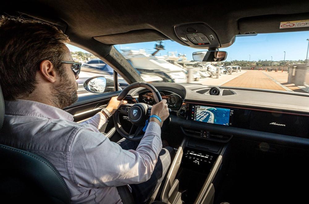 Neil Winn test driving Porsche Macan Electric