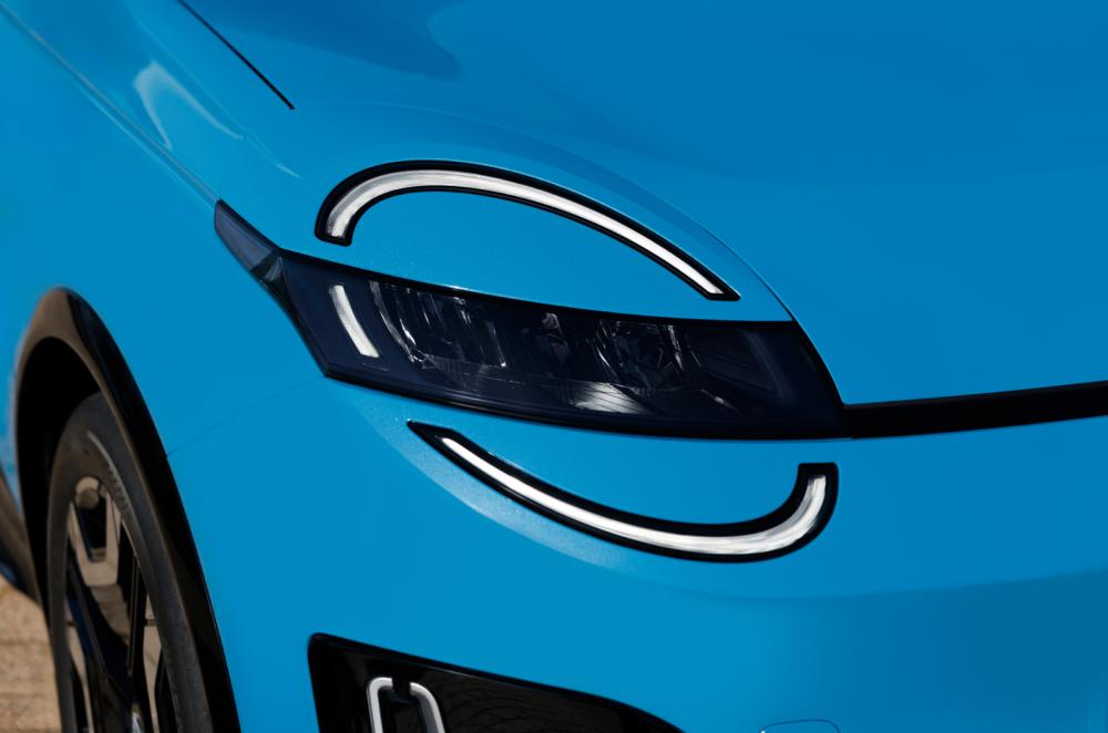 Blue Nissan Micra headlight detail