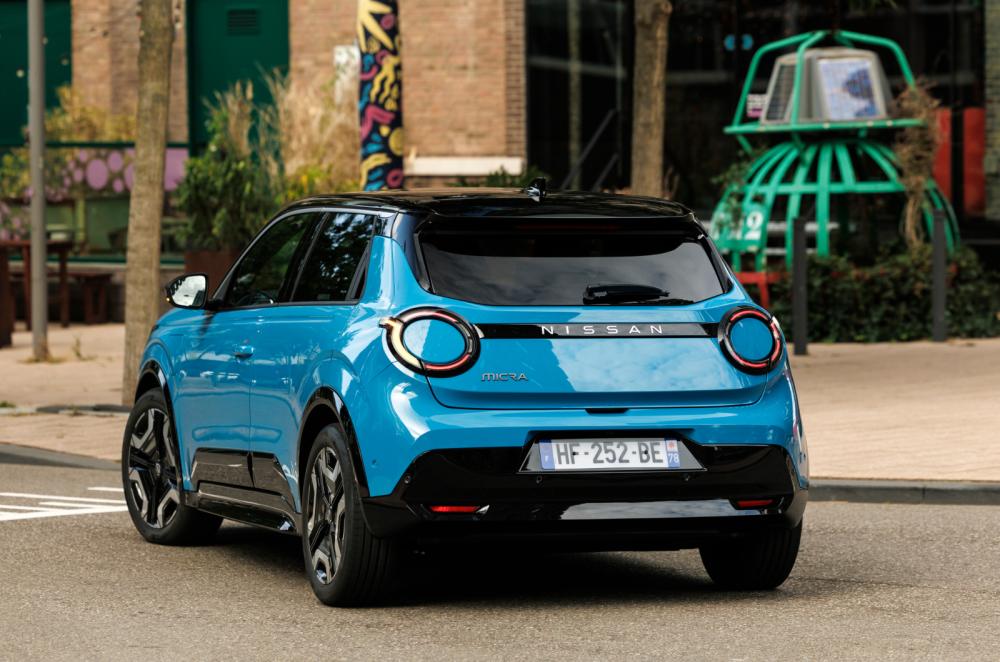Blue Nissan Micra rear cornering
