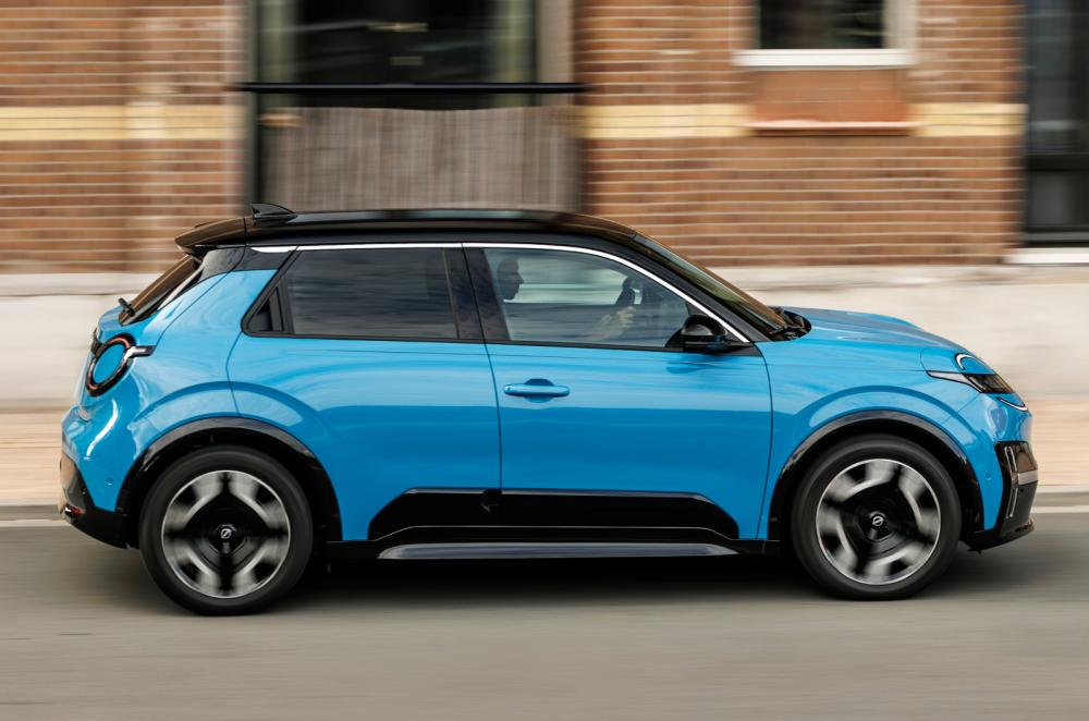 Blue Nissan Micra tracking side